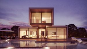 Vue d'une maison d'habitation contemporaine aux formes cubiques, assortie d'une piscine au premier plan